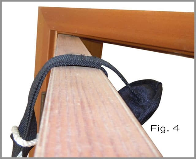 Place the door stop over the top of the door